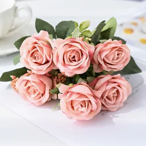 Artificial pink rose flower bouquet for wedding home desktop decoration and craft floral arrangement.