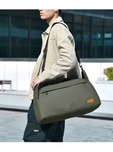 Large capacity travel duffel bag for men, waterproof sports gym bag for short trips and business.