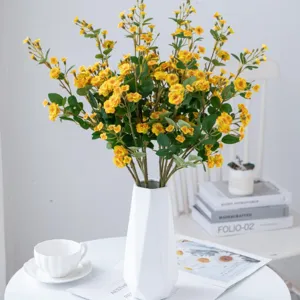 Artificial yellow rose flower bouquet in white geometric vase home decor photography