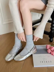 Detailed view of breathable thin solid color vertical striped mid-tube women socks in grey.
