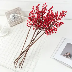 Artificial red berries decorative branch for home living room and holiday arrangement.