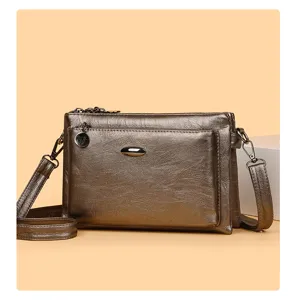 Detailed view of the vintage PU leather crossbody bag, multi-layer design, elegant gold-brown.
