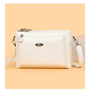 Detail view of the white multi-layer PU leather casual women crossbody shoulder bag.