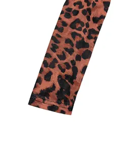 Close-up detail of the brown leopard print mesh fabric with fine stitching lines.