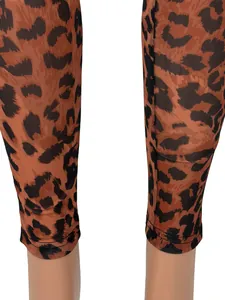 Close-up detail of leopard print mesh fabric texture on slim fit sexy jumpsuit leggings