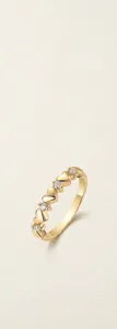 Detailed view of a gold-plated S925 silver ring featuring heart shapes and moissanite