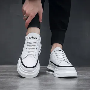 Trendy white chunky sneakers for men with air cushion and platform soles.