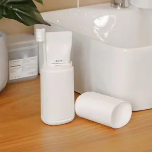 Portable travel mouthwash cup toothbrush toothpaste storage box set for business trips.
