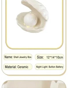 Detail view of the ceramic shell jewelry box showing pearl night light design and smooth finish.
