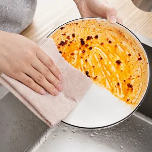 Thickened plant fiber kitchen dishcloth designed for oil absorption and efficient cleaning.
