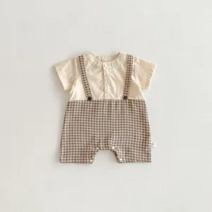 Baby short sleeve romper, fake two piece design with brown plaid shorts and doll collar.
