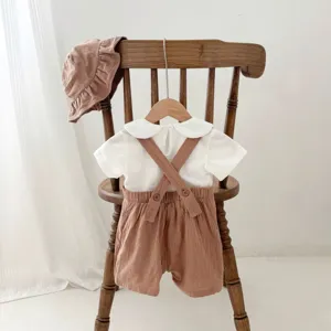 Summer baby cotton outfit set with short sleeve shirt, suspender shorts and cute hat.