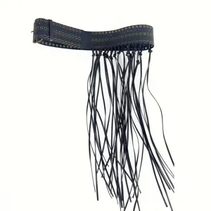 Wide black leather belt featuring metal eyelets and long fringe for an edgy fashion look.