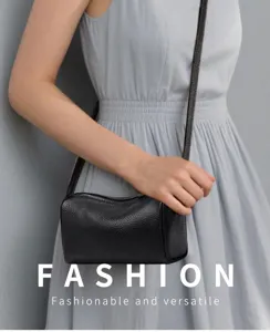 Black cylindrical leather crossbody bag detail, stylish minimal daily shoulder purse