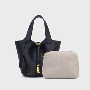 Stylish PU leather bucket handbag with chevron pouch, classic minimalist design for women.