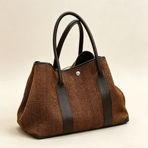 Stylish autumn winter wool tote bag with brown herringbone pattern and leather handles.