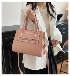 Stylish pink commuter handbag with crocodile texture detail, elegant single shoulder messenger bag.