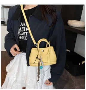 Mini yellow leather handbag, versatile shoulder and crossbody bag for women daily commute.