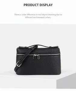 Black mini vanity bag chic structured handbag with top handle and adjustable crossbody strap.