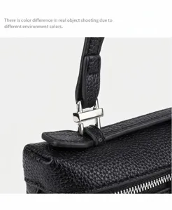 Mini black handbag hardware detail, premium textured leather and silver metal lock closure.