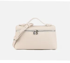 Beige mini box handbag detailed view, structured leather crossbody bag with top handle.