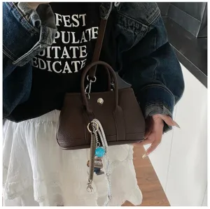 Mini structured top handle handbag chic casual shoulder crossbody bag for women daily commute.
