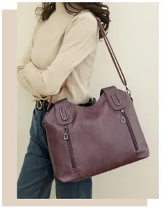 Detail view of the versatile oil-wax leather shoulder tote bag, showing large capacity and zipper.