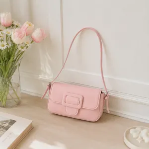 Chic pink baguette shoulder bag detail, stylish minimalist design for women's daily wear.