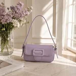 Minimalist light purple shoulder baguette bag, chic minimalist retro handbag detail view.