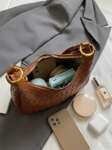 Stylish brown woven shoulder bag for women, classic hobo design with elegant gold-tone hardware.
