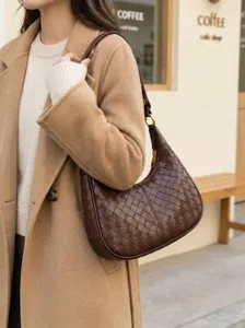 Detailed view of retro dark brown woven leather shoulder bag, casual hobo style for women.