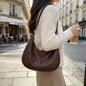 Retro woven shoulder bag for women, stylish brown leather hobo purse, casual chic underarm bag.