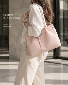 Elegant pink leather shoulder tote bag for women, stylish commuting handbag with chic belt detail.