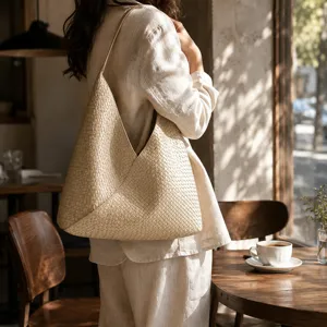 Detailed lifestyle shot showcasing the exquisite woven texture of the stylish shoulder bag.