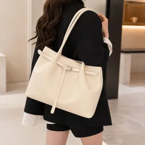 Detailed view showcasing the elegant texture and sturdy strap of the minimalist beige tote bag.
