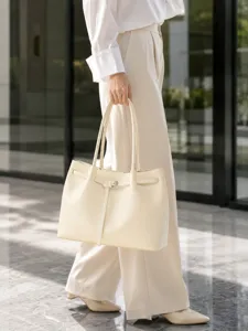 Elegant beige leather tote bag with stylish buckle strap for women daily work commute use.