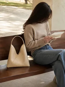 Beige woven leather shoulder bag, stylish casual hobo tote for women, elegant daily carry accessory.
