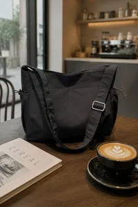 Waterproof nylon crossbody shoulder bag, large capacity lightweight commuter tote bag detail.