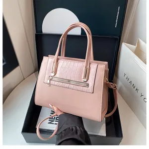 Stylish pink casual shoulder crossbody bag with elegant crocodile texture front pocket.