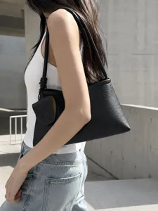 Sac hobo épaule noir en cuir minimaliste pour femme, sac cabas élégant et tendance.