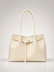 Minimalist beige tote shoulder bag for women, chic commuter style, elegant design.