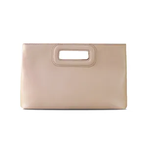 Close-up detail of the nude PU leather handbag showcasing smooth texture and neat stitching.