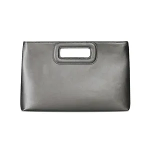 Detail view of the elegant grey metallic PU leather clutch bag with modern cutout handle.