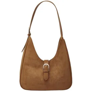 Brown suede hobo shoulder bag for women, chic crescent baguette bag with buckle detail.