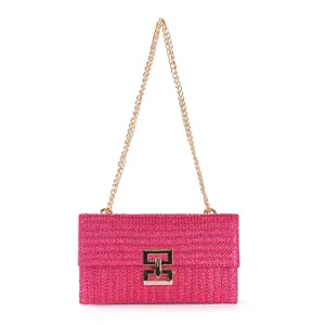 Pink woven straw shoulder bag detail, featuring elegant gold chain strap and chic metal twist-lock clasp.