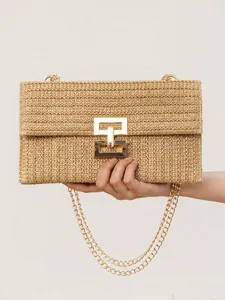Chic straw woven shoulder bag for women, resort style with gold chain and twist lock.