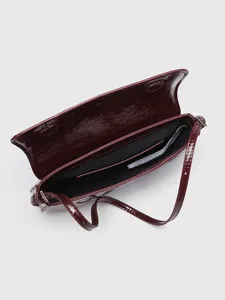 Red patent leather baguette shoulder bag for women, stylish flap design and slim strap.