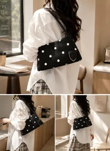 Detailed view of the stylish black and white polka dot underarm shoulder bag lifestyle shot.