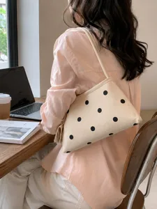 Casual chic polka dot canvas shoulder bag for women, trendy minimalist underarm daily purse.