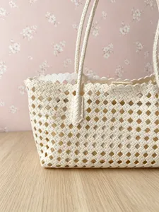 Cream woven tote bag with diamond lattice cutout design, stylish shoulder handbag for daily use.
